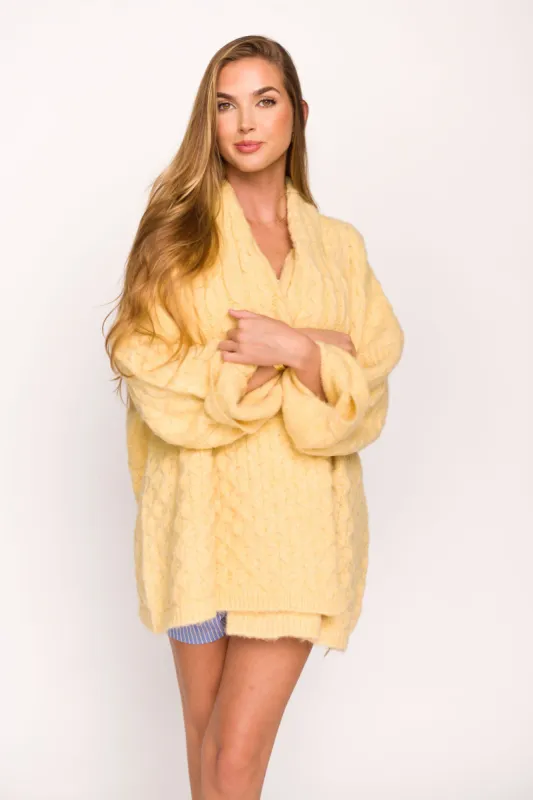 Regina Cable Knit Cardigan in Butter Yellow sold by Worth Collective