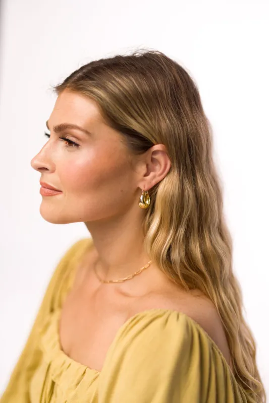 Coco Chunky Gold Hoop Earrings in Gold sold by Worth Collective