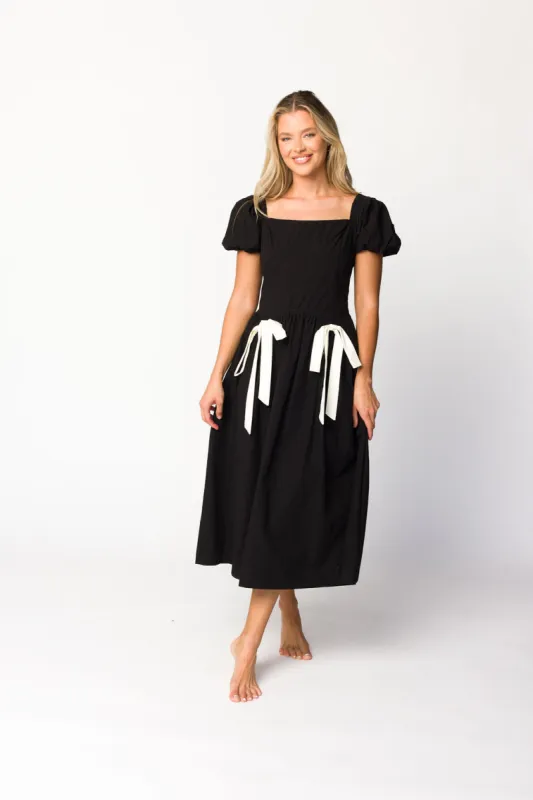 Ruby Midi Dress with Bow Detail in Black sold by Worth Collective