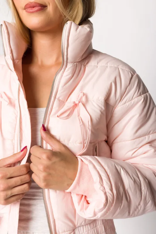 Eloise Ribbon Bow Puffer Jacket in Pink sold by Worth Collective