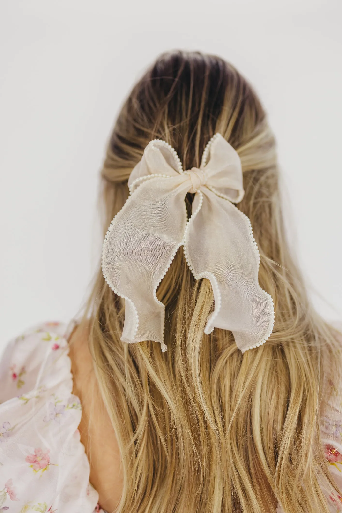 Pearl Long Bow Clip in Cream sold by Worth Collective