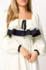Megan Ruffle Long Sleeve Midi Dress in Cream/Navy sold by Worth Collective