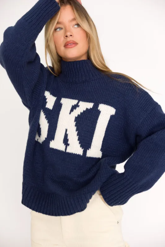 Ski Graphic Oversized Turtleneck Sweater in Navy/Ivory sold by Worth Collective