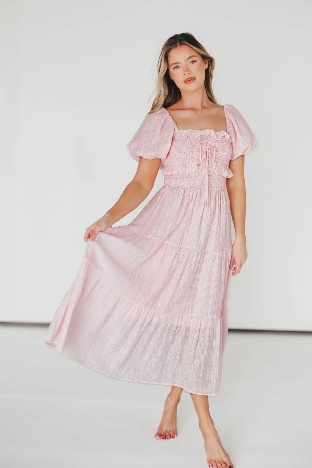 Lainey Ruffle Midi Dress in Light Pink sold by Worth Collective