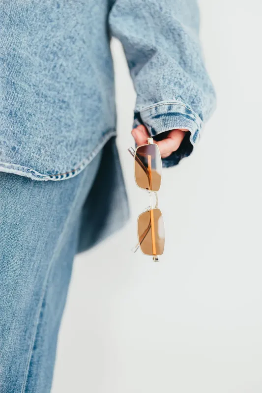 The Monroe Sunglasses in Gold-Brown sold by Worth Collective