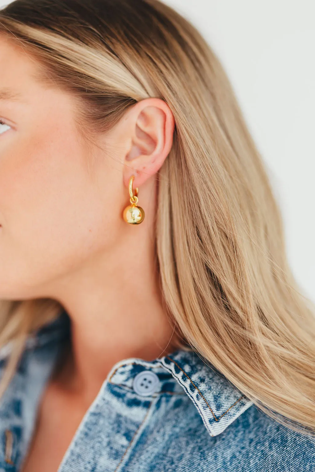 The Greta Hoops in Gold sold by Worth Collective