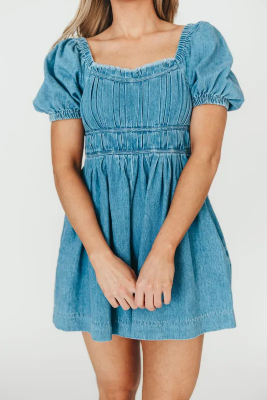 Juniper Puff Sleeve Pleated Romper in Washed Denim sold by Worth Collective