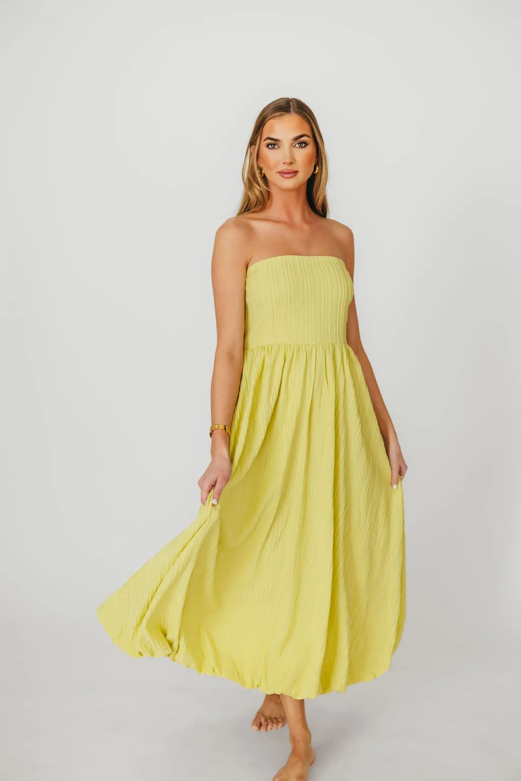 Trinity Strapless Maxi Dress in Celery sold by Worth Collective
