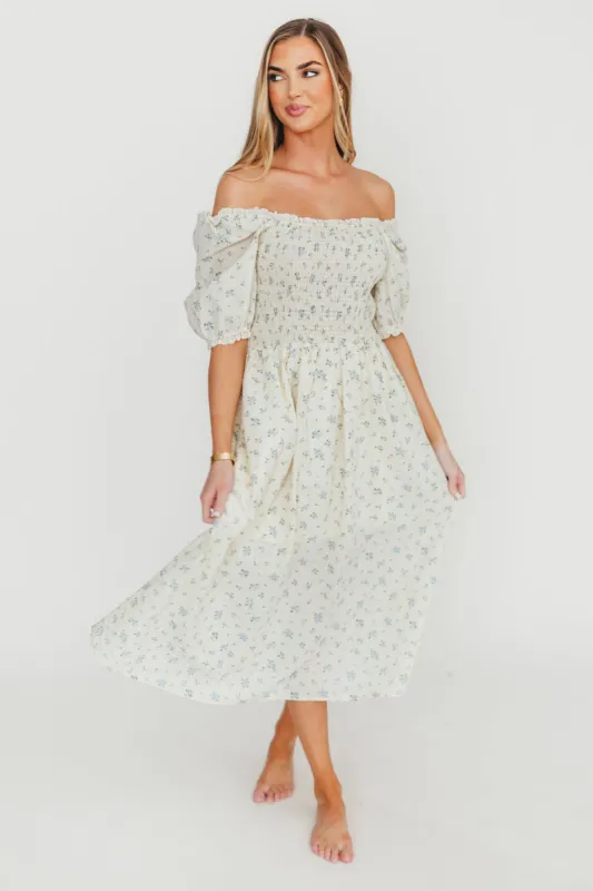 Kinsley Ditsy Floral Smocked Midi Dress in Sky Blue sold by Worth Collective