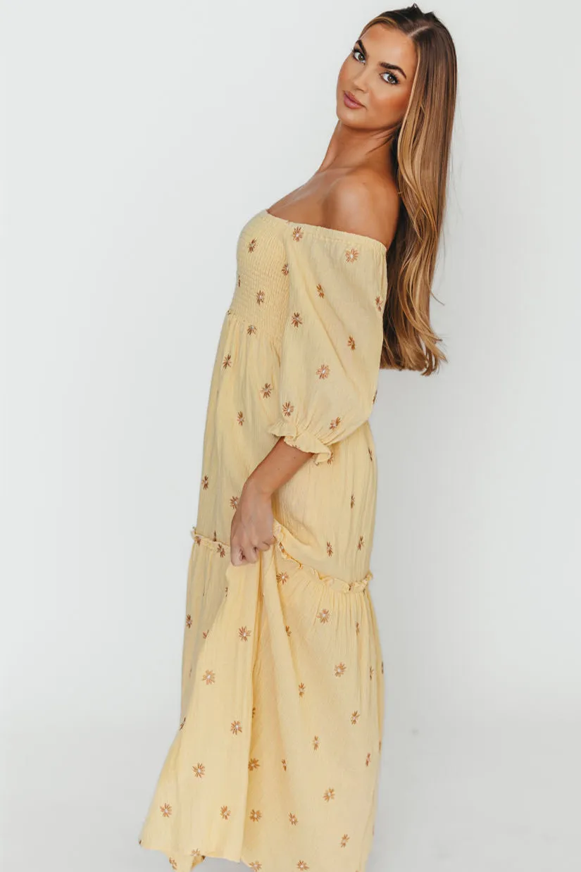 Nia Embroidered Floral Midi Dress in Beige sold by Worth Collective