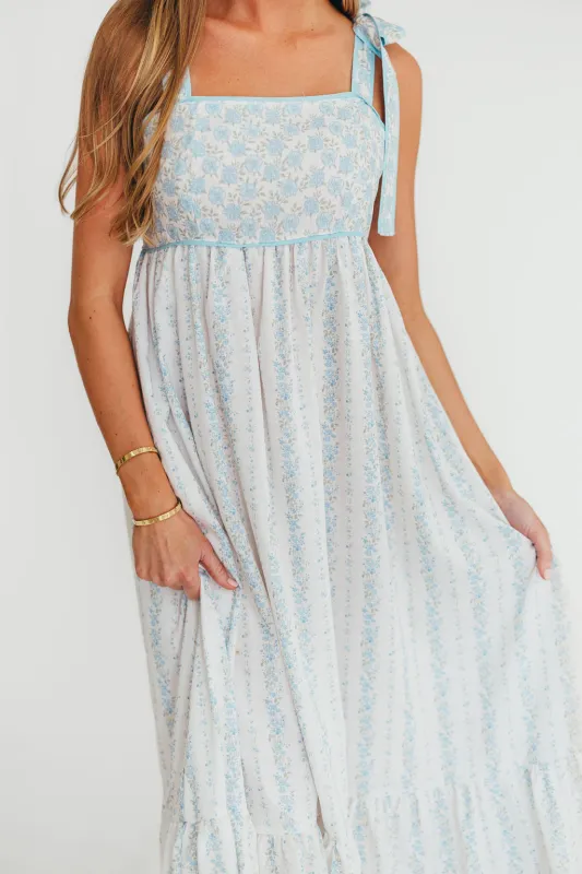 Kelly Adjustable Tie Maxi Dress in French Blue Floral sold by Worth Collective