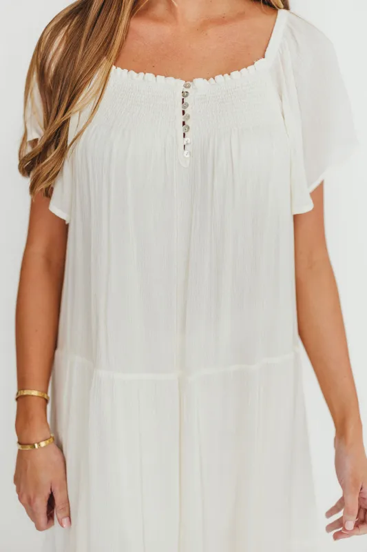 Eloise Flutter Sleeve Midi Dress in Off-White sold by Worth Collective