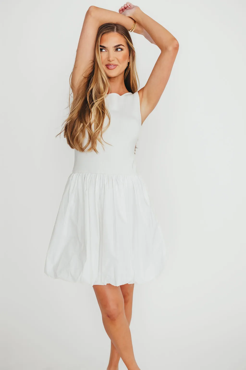 Audrey Bubble Mini Dress in White sold by Worth Collective
