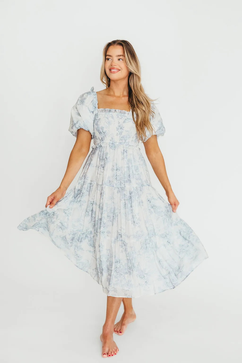 Elena Floral Print Smocked Midi Dress in Blue - Bump Friendly & Inclusive Sizing sold by Worth Collective