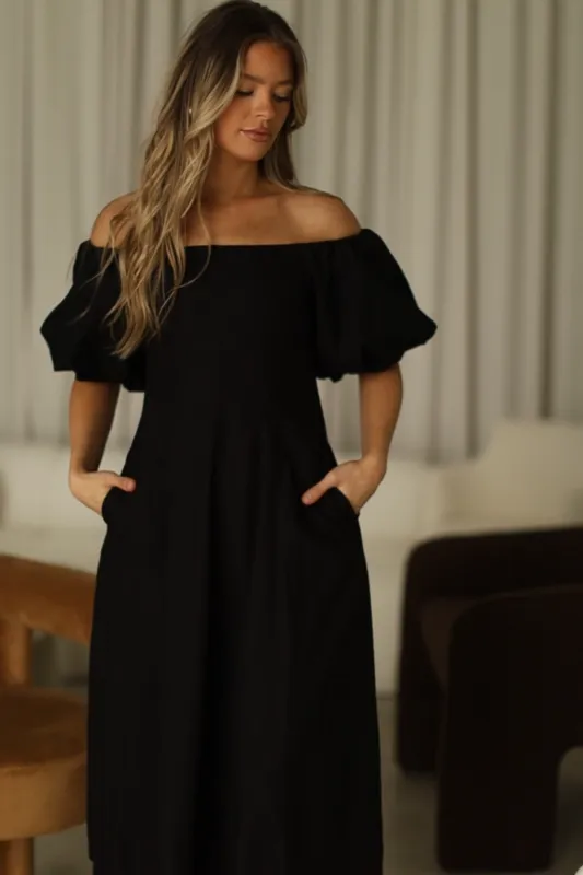 Serenity Off-The-Shoulder Midi Dress in Black sold by Worth Collective
