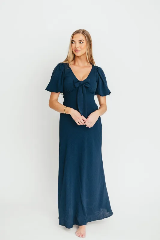 Selena Bow Front Maxi Dress in Navy sold by Worth Collective