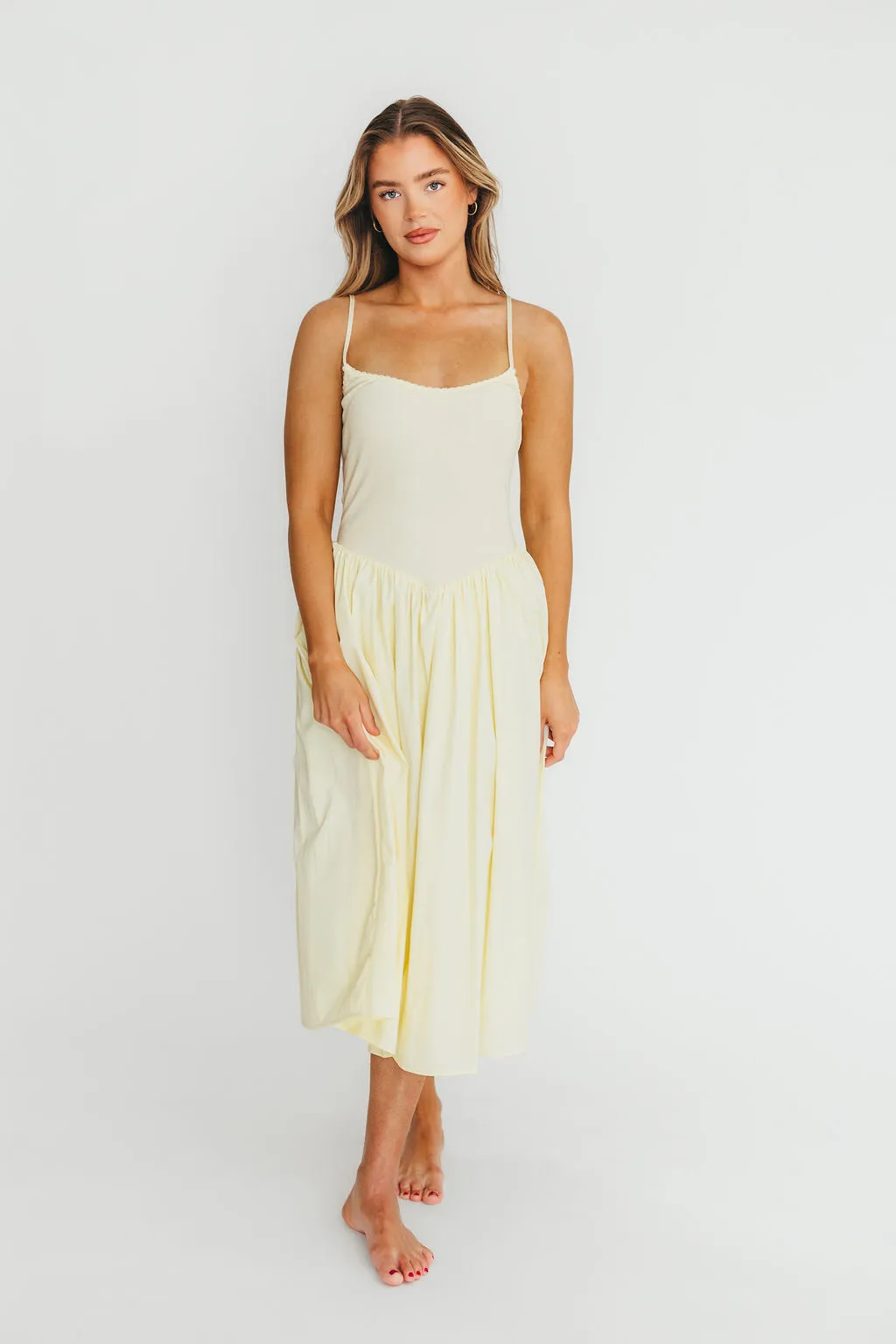 Lucy Midi Dress in Yellow sold by Worth Collective