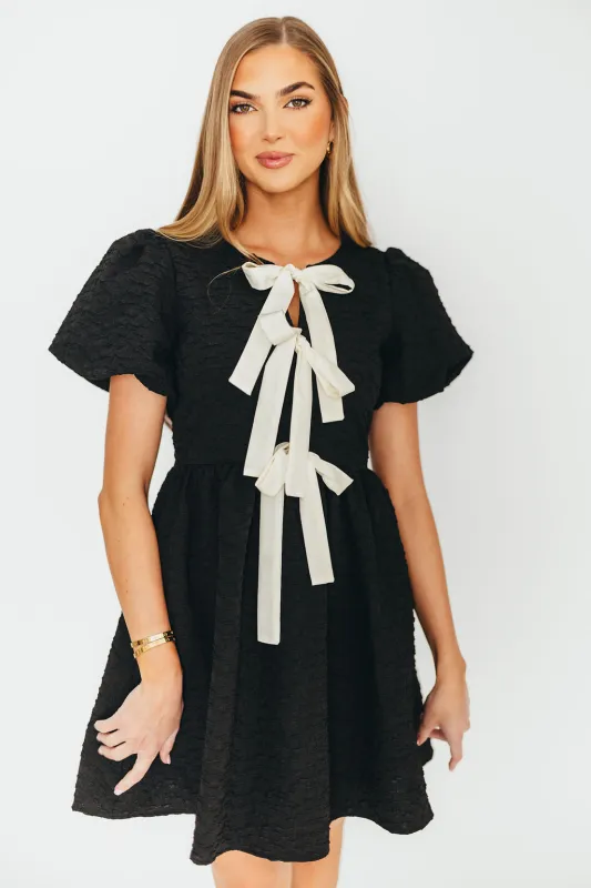 Summer Bow Tie Front Mini Dress In Black sold by Worth Collective