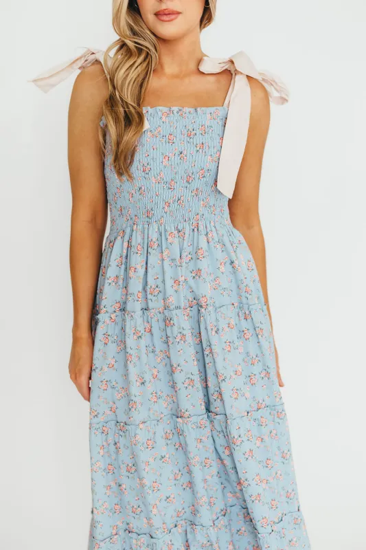 Cora Smocked Bow Tie Strap Maxi Dress in Blue sold by Worth Collective