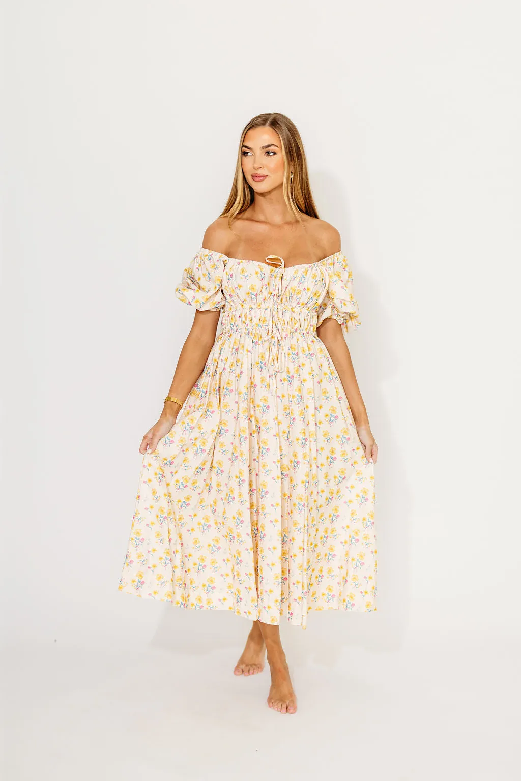 Kimber Midi Dress with Drawstring Detail in Yellow Floral sold by Worth Collective