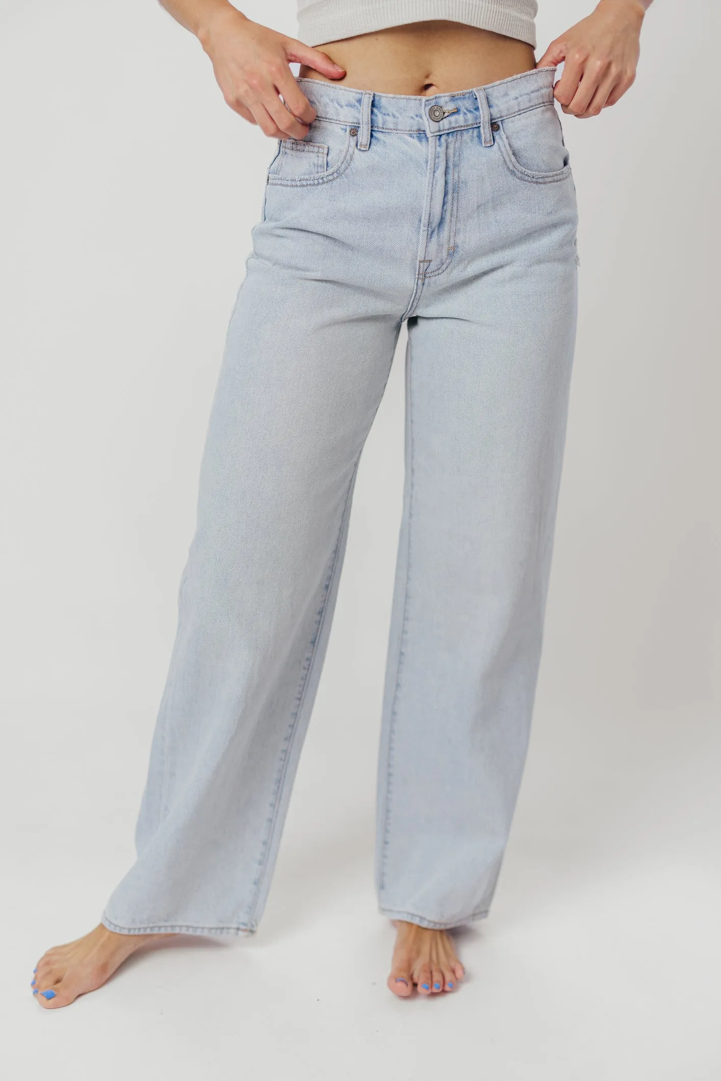 Nori Lightly Distressed Stretch Denim in Light Wash sold by Worth Collective