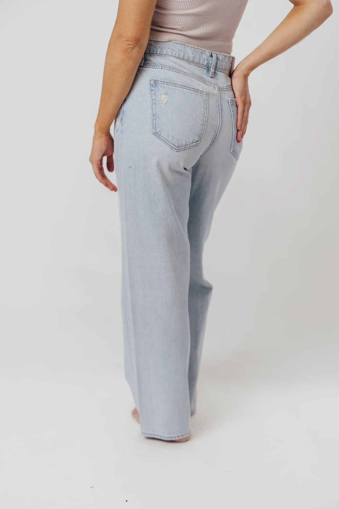 Nori Lightly Distressed Stretch Denim in Light Wash sold by Worth Collective product image thumbnail 4
