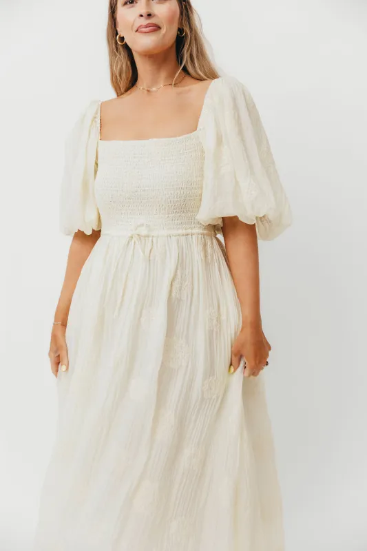 Aimee Smocked Embroidered Floral Midi Dress in Ivory sold by Worth Collective