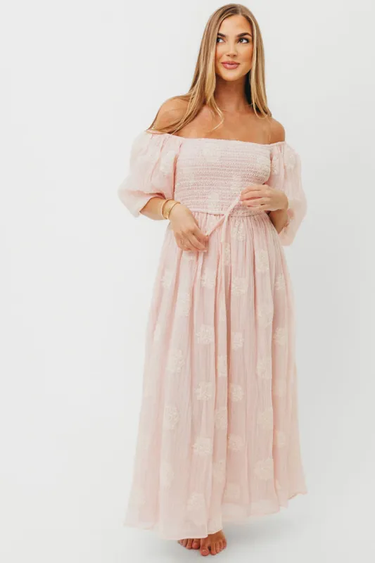 Aimee Smocked Embroidered Floral Midi Dress in Blush sold by Worth Collective