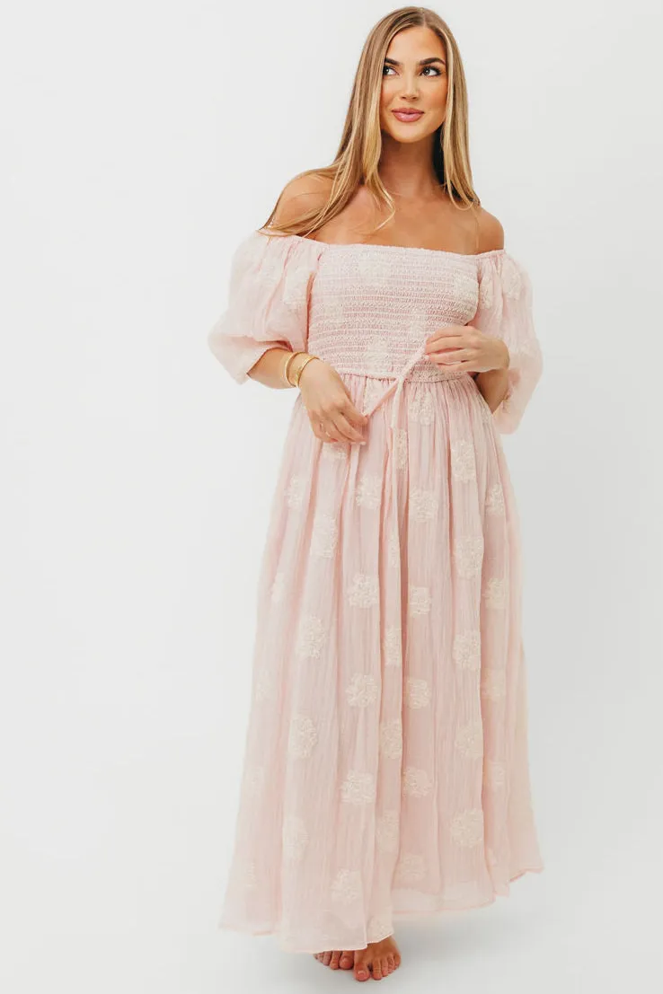 Aimee Smocked Embroidered Floral Midi Dress in Blush sold by Worth Collective