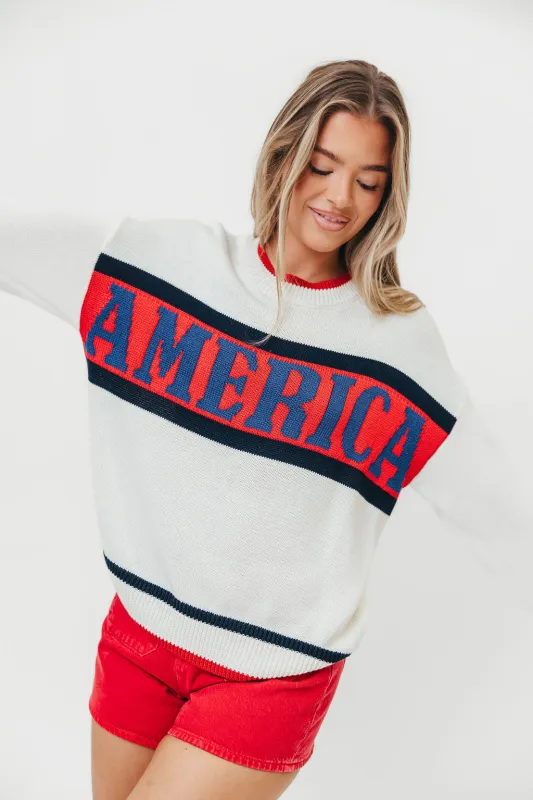 America Graphic Long Sleeve Crew Neck Sweater in White Multi made by Le Lis