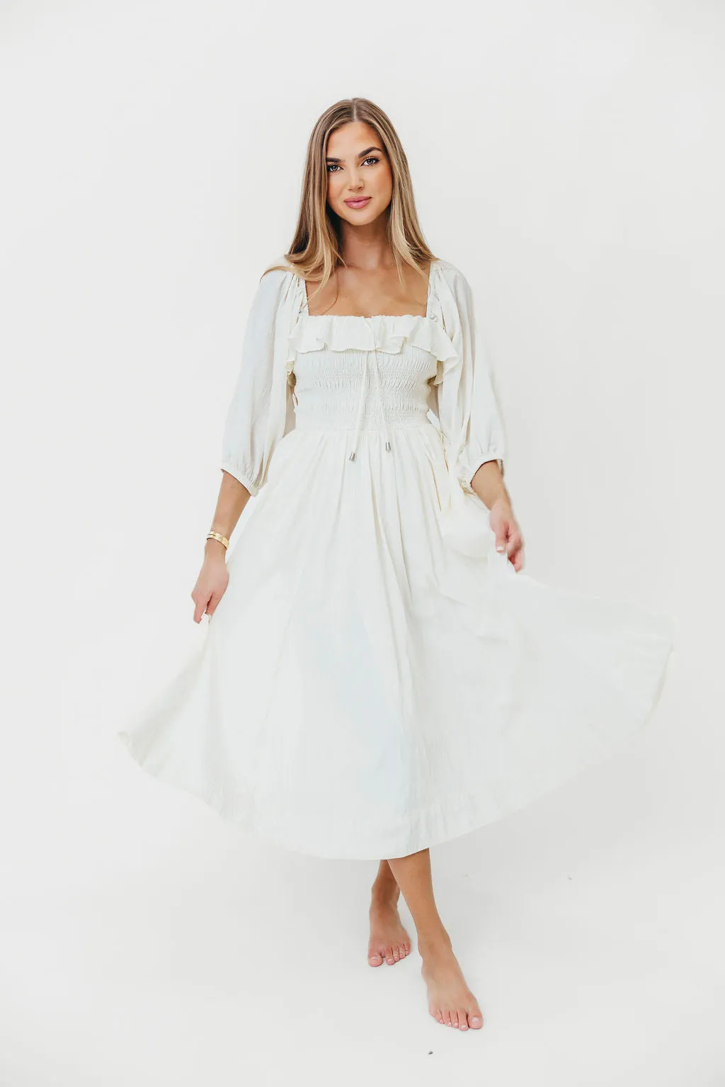 Miffy Ruffled Smocking Flowy Midi Dress in Ivory sold by Worth Collective