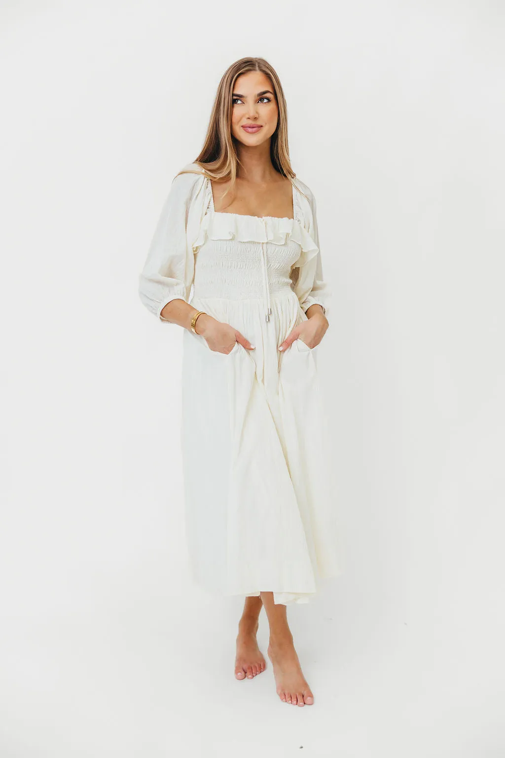 Miffy Ruffled Smocking Flowy Midi Dress in Ivory sold by Worth Collective product image thumbnail 3