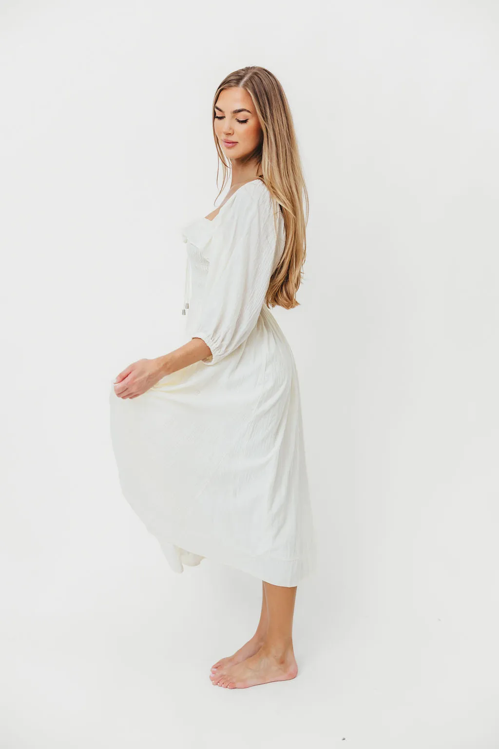 Miffy Ruffled Smocking Flowy Midi Dress in Ivory sold by Worth Collective product image thumbnail 4