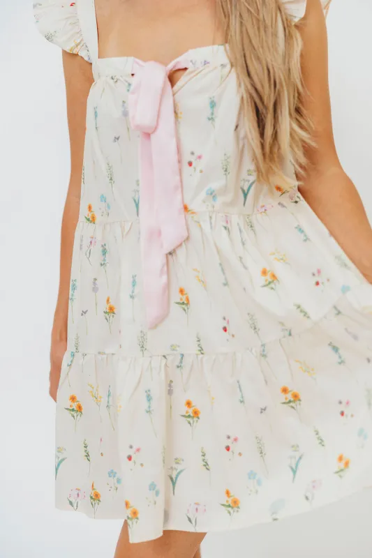 Lulu Flutter Sleeve Mini Dress in Floral sold by Worth Collective