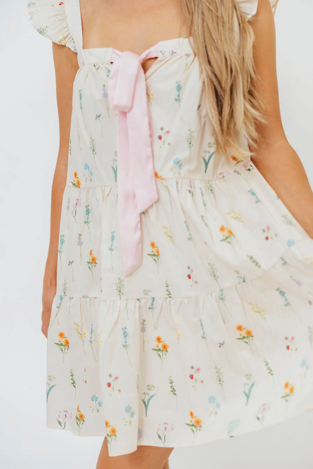 Lulu Flutter Sleeve Mini Dress in Floral sold by Worth Collective