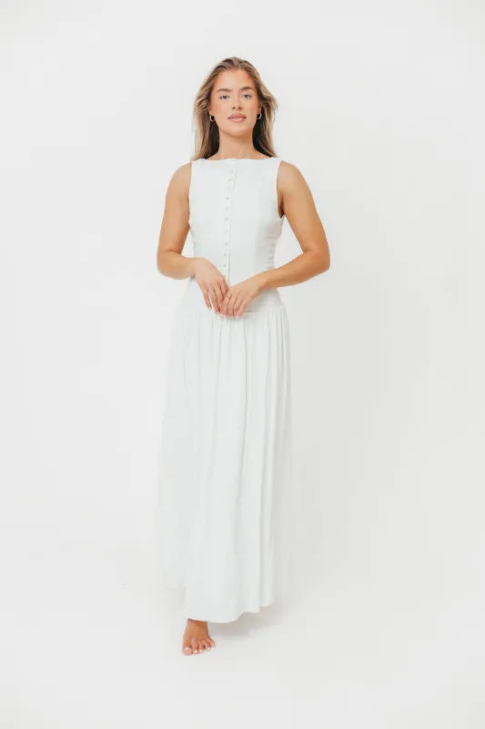 Sondra Stretch Maxi Dress with Button Detail & Dropped Waist in Off-White sold by Worth Collective