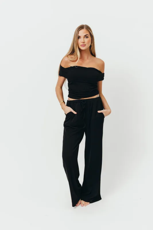 Zendaya Off-Shoulder Top and Drawstring Pants Set in Black sold by Worth Collective