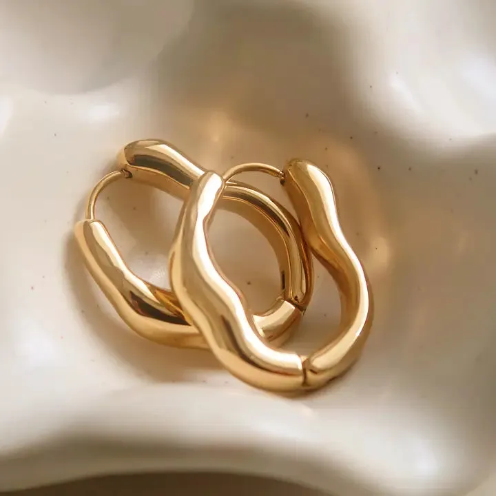 Darcy 18K Gold Non-Tarnish Oval Hoop Earring in Yellow Gold sold by Worth Collective product image thumbnail 2