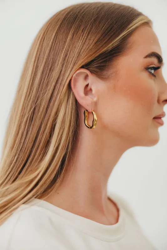 Darcy 18K Gold Non-Tarnish Oval Hoop Earring in Yellow Gold sold by Worth Collective