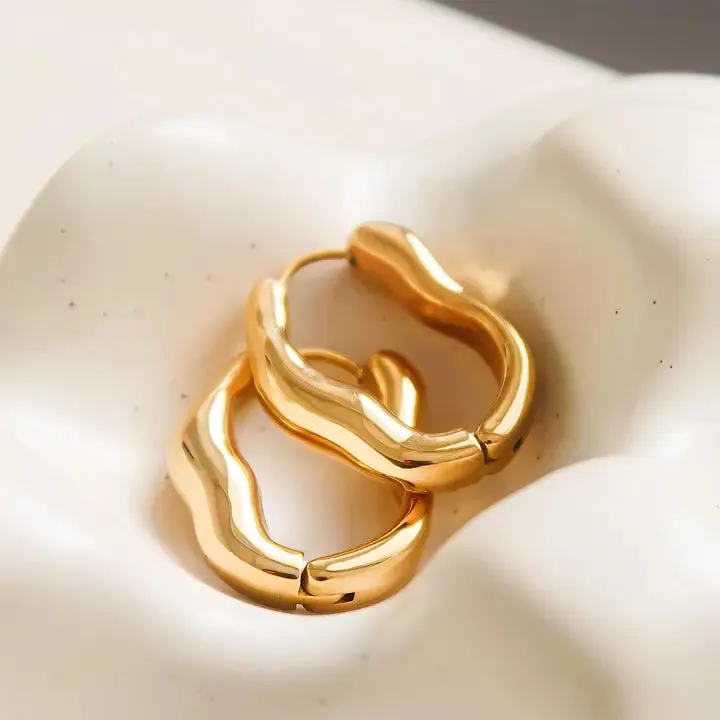 Darcy 18K Gold Non-Tarnish Oval Hoop Earring in Yellow Gold sold by Worth Collective product image thumbnail 3