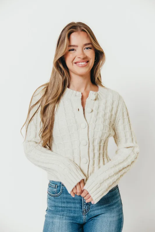 Adrienne Cable Knit Cardigan in Cream sold by Worth Collective