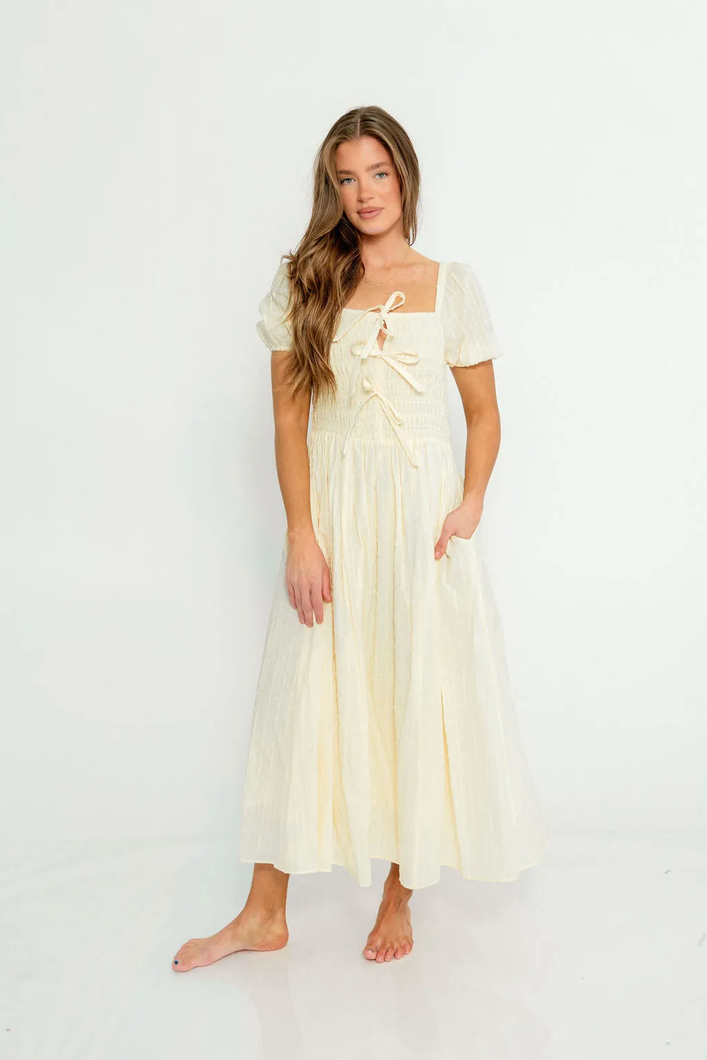 Arabelle Smocked Bow Detail Maxi Dress in Lemon Water sold by Worth Collective product image thumbnail 4
