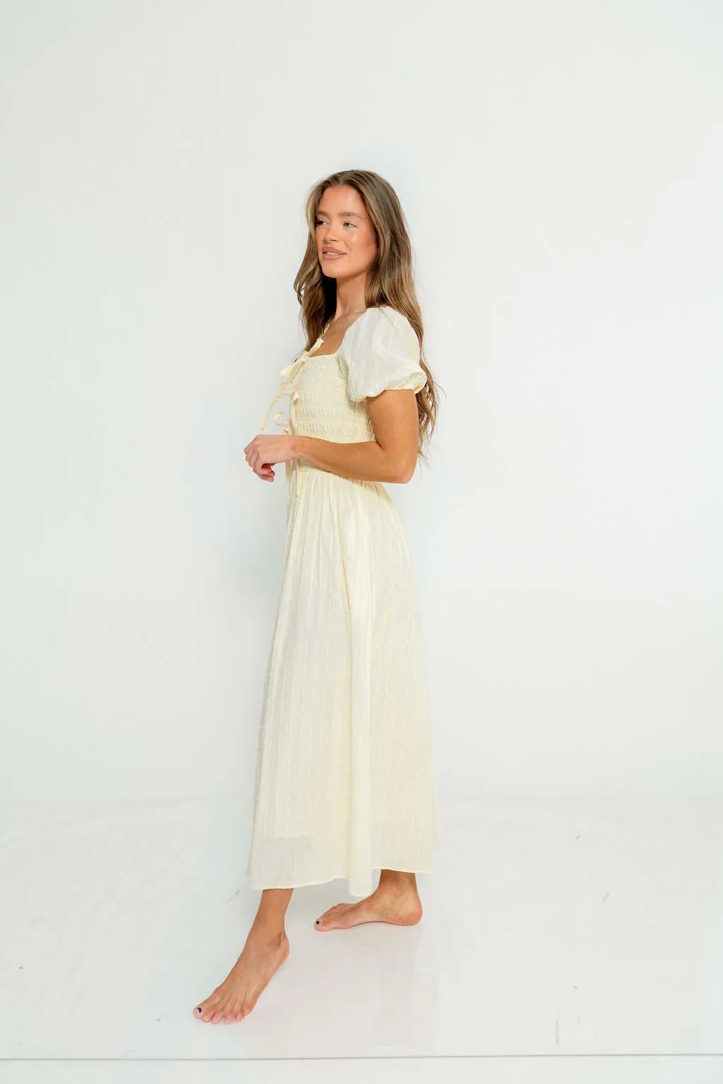 Arabelle Smocked Bow Detail Maxi Dress in Lemon Water sold by Worth Collective product image thumbnail 2