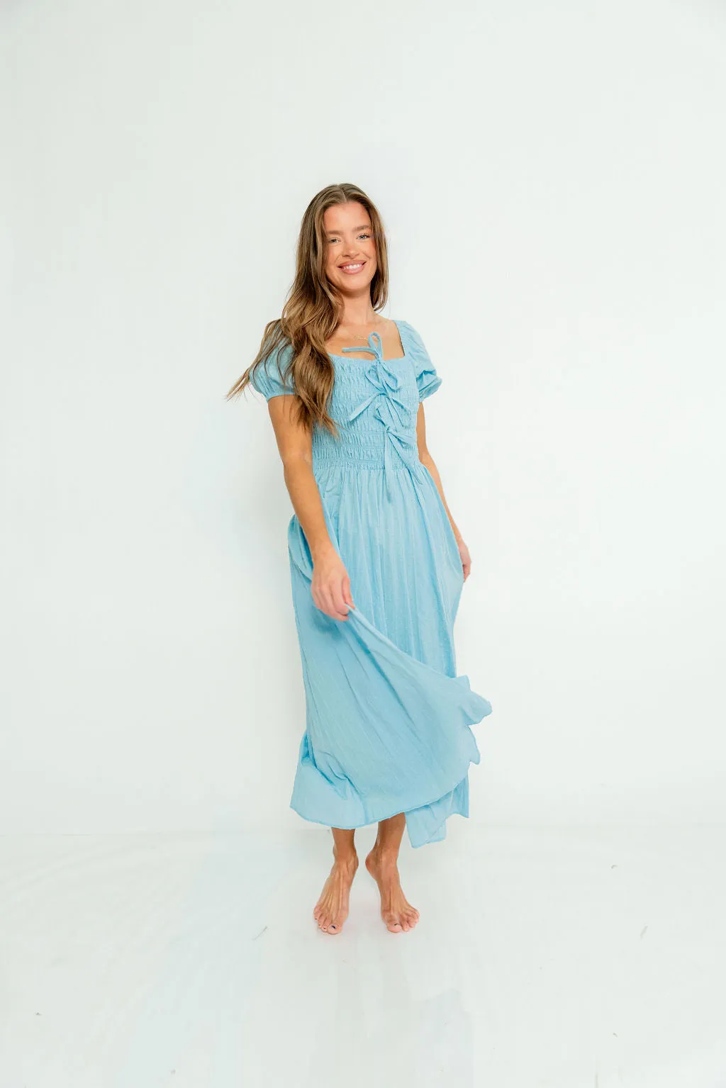 Arabelle Smocked Bow Detail Maxi Dress in Blue Aura sold by Worth Collective product image thumbnail 3