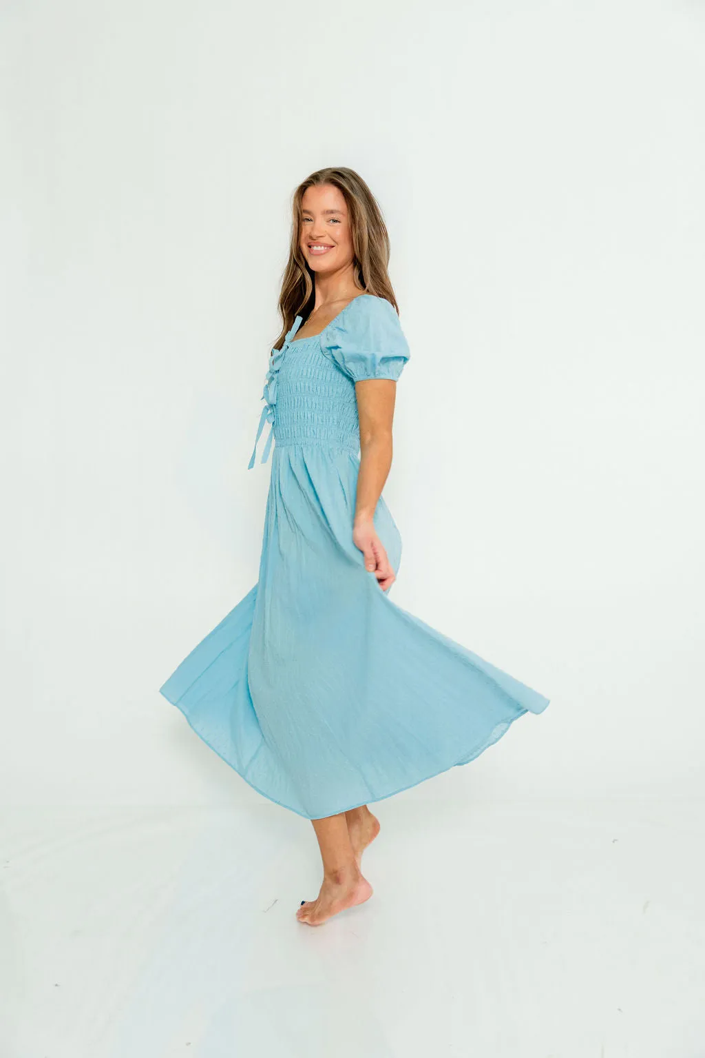 Arabelle Smocked Bow Detail Maxi Dress in Blue Aura sold by Worth Collective product image thumbnail 4