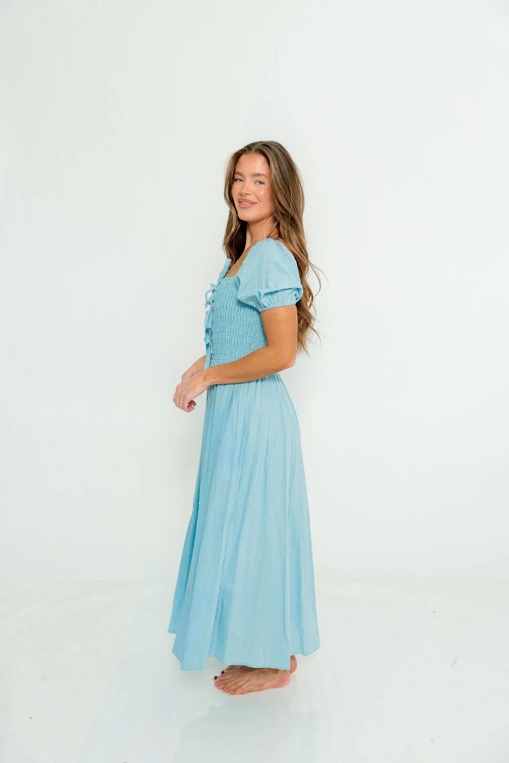 Arabelle Smocked Bow Detail Maxi Dress in Blue Aura sold by Worth Collective product image thumbnail 2