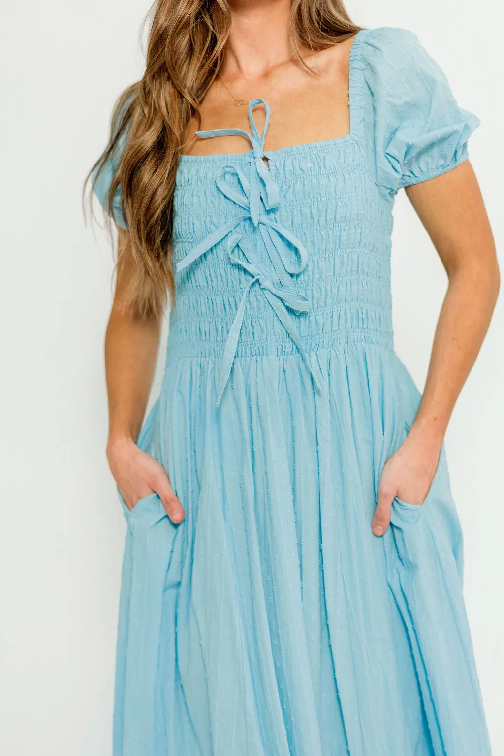 Arabelle Smocked Bow Detail Maxi Dress in Blue Aura sold by Worth Collective product image thumbnail 5