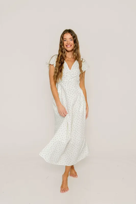 Evie Floral Flutter Sleeve Maxi Dress in Ivory Multi sold by Worth Collective