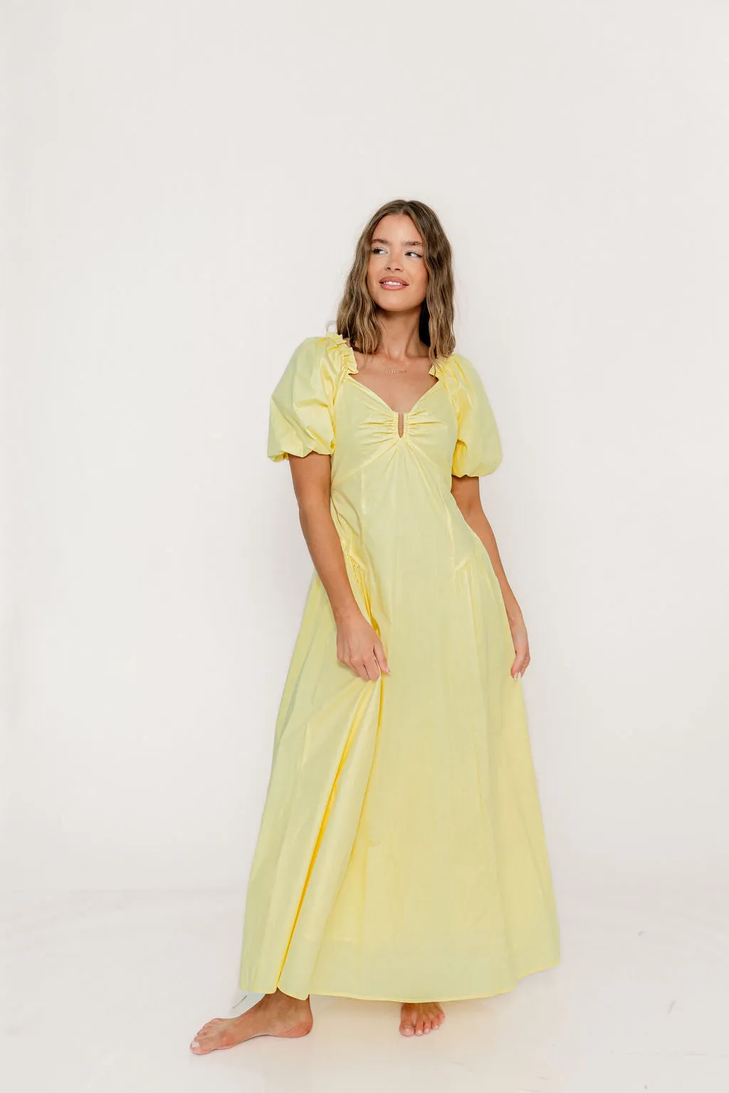 Melina Bubble Sleeve Maxi Dress in Butter Yellow sold by Worth Collective