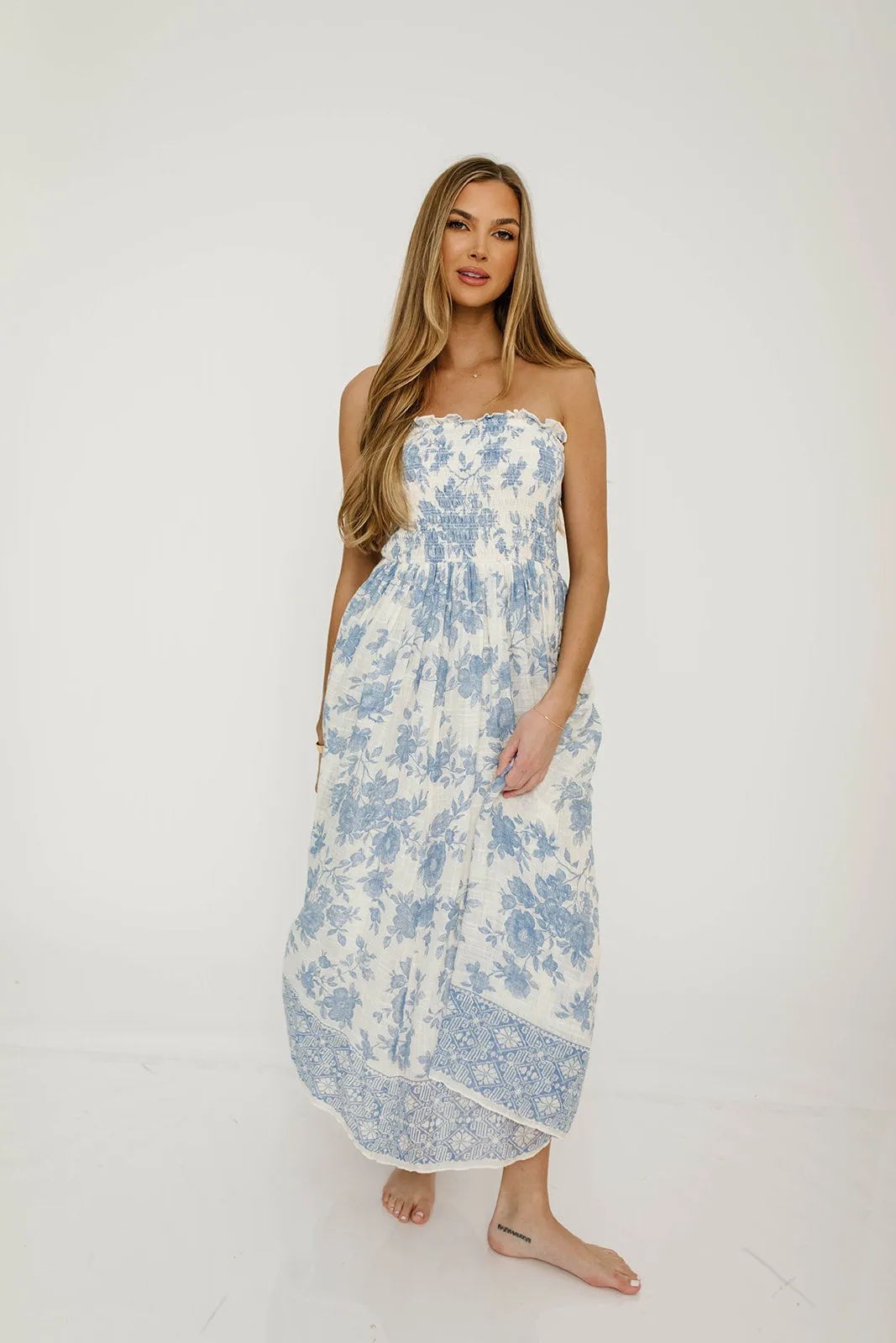 Solena Floral Smocked Midi Dress in Ivory/Blue sold by Worth Collective